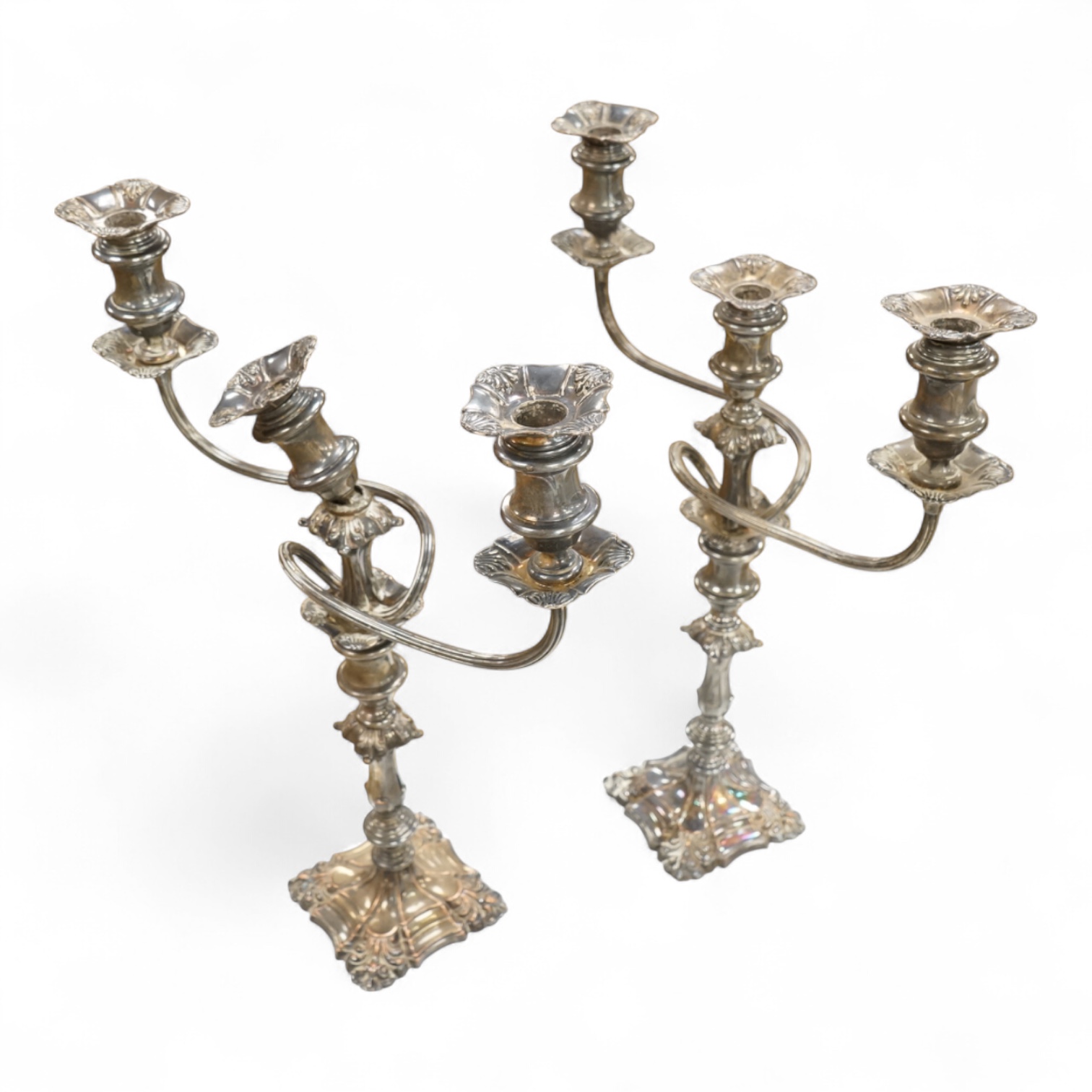 A pair of silver plated two branch three light candelabra, 53cm high